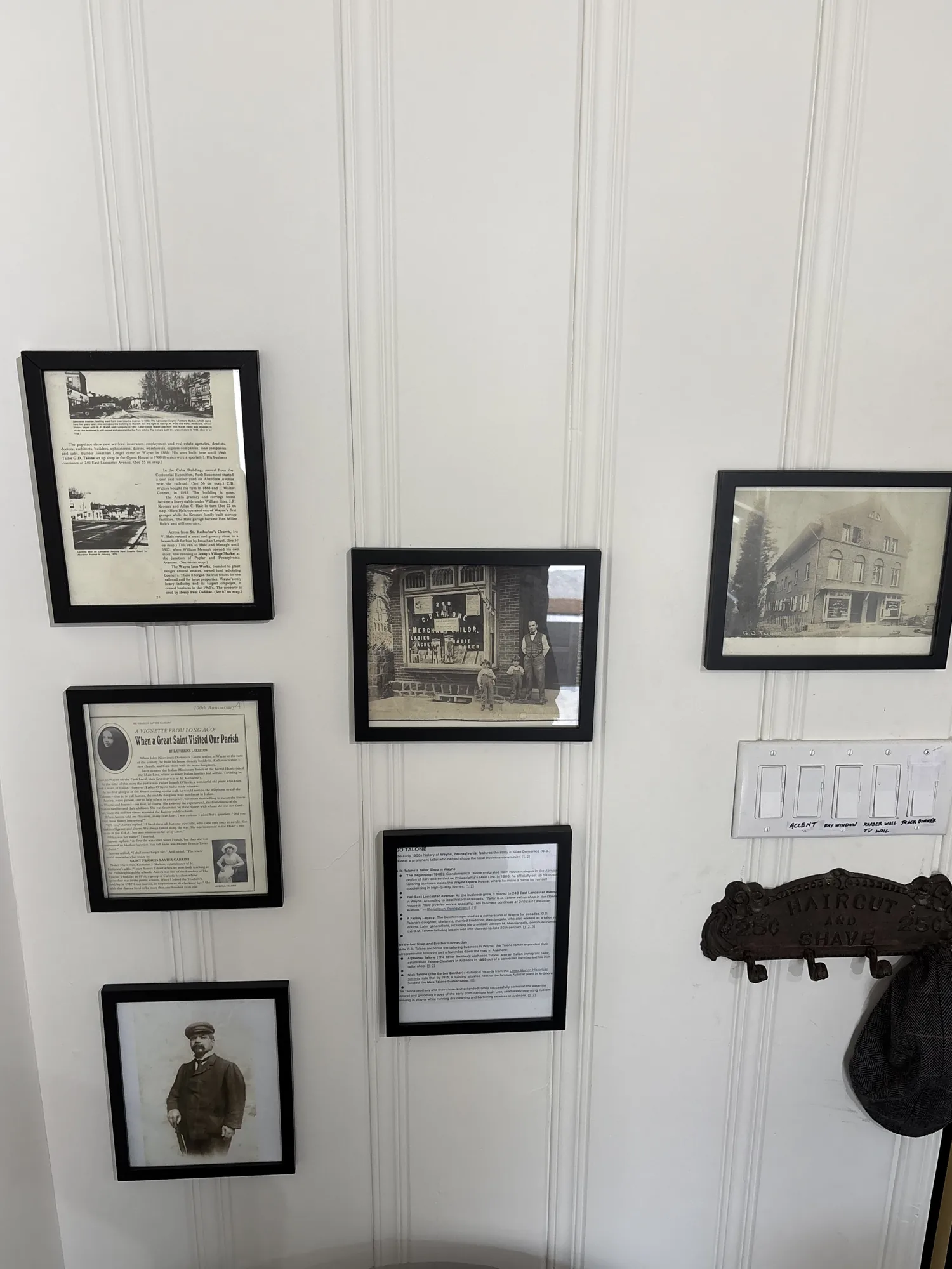 Framed historic photos and articles on the wall